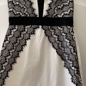 Strapless white cocktail with black lace overlay